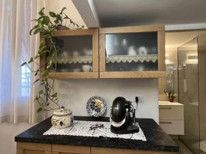 a kitchen counter with a coffee maker on a counter top at Apartment Casa Lulú by Interhome in San Lorenzo al Mare