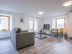 a living room with a couch and a table at Apartment Harbour Nights 7C by Interhome in Lossiemouth +22 photos