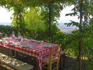 a table with a red and white checkered table cloth at Holiday Home Bellavista by Interhome in Cortona