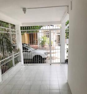 a room with a garage with a car in it at Rest 1 in Santa Marta