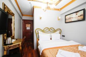 Postel nebo postele na pokoji v ubytování Californiacityhotel