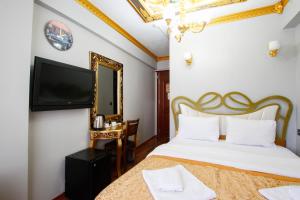 Postel nebo postele na pokoji v ubytování Californiacityhotel