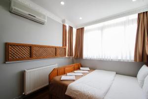 Postel nebo postele na pokoji v ubytování Californiacityhotel