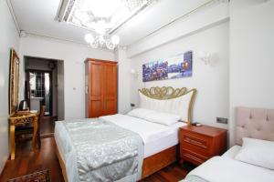 Postel nebo postele na pokoji v ubytování Californiacityhotel