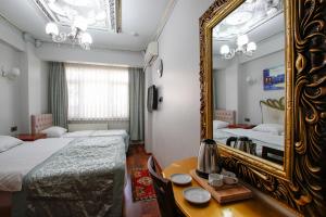 Postel nebo postele na pokoji v ubytování Californiacityhotel