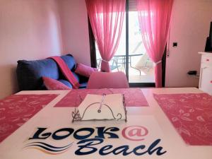 Postel nebo postele na pokoji v ubytování Lookatbeach