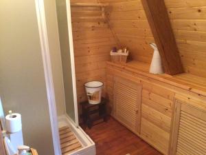 a small cabin with a toilet in a room at Chalet Natura Sport&Relax in Cavaliere