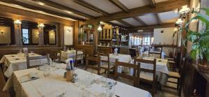 a restaurant with tables and chairs in a room at Al Cantuccio in Scopello