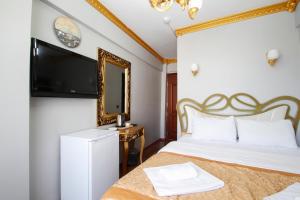 Postel nebo postele na pokoji v ubytování Californiacityhotel