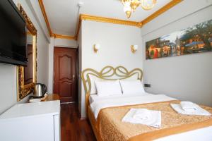 Postel nebo postele na pokoji v ubytování Californiacityhotel