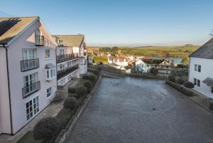 a view of a river between two buildings at 13 Combehaven in Salcombe