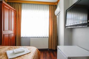 Postel nebo postele na pokoji v ubytování Californiacityhotel