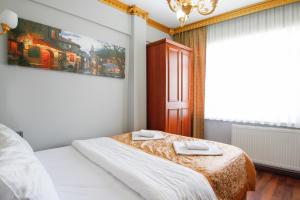 Postel nebo postele na pokoji v ubytování Californiacityhotel