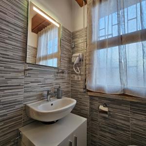 Koupelna v ubytování Corteantica RHO-FIERA by Rhospitality