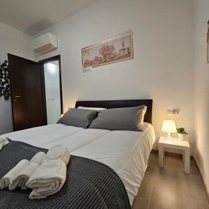 Postel nebo postele na pokoji v ubytování Corteantica RHO-FIERA by Rhospitality