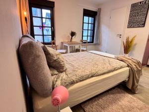 Postel nebo postele na pokoji v ubytování Gemütlich Mitten in Neu-Isenburg