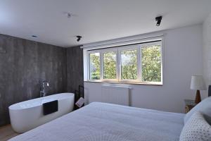 Postel nebo postele na pokoji v ubytování Chez Laure - Gîte 4 personnes, près de Durbuy + 31 fotografií