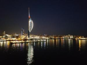a view of the burj al arab at night at Portsmouth House near Center 3 Bedrooms in Portsmouth