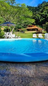 Der Swimmingpool an oder in der Nähe von Hotel Fazenda Monteiro