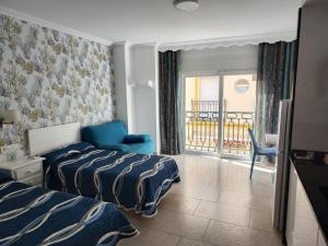 Posteľ alebo postele v izbe v ubytovaní Apartamentos Caracas