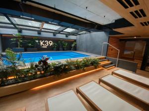 a large indoor pool with plants in a building at Vistula Avenue Apartment Free Parking in Krakow