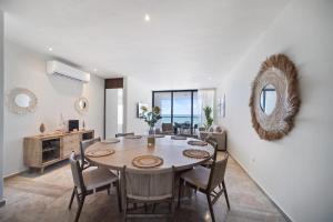 a dining room with a table and chairs at SIELA Oceanfront Luxury 4 BR Villa in San Bruno +20 photos