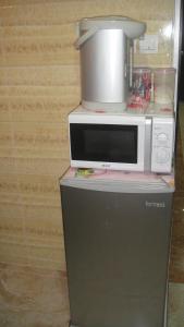 O bucătărie sau chicinetă la Philippine Hostel