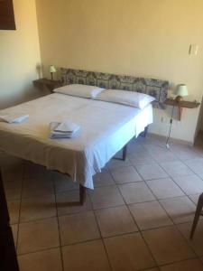 A bed or beds in a room at Antica dimora siciliana