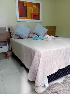 a bedroom with a bed with towels on it at Apartamento BEIRA MAR in Fortaleza