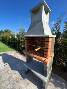 a outdoor brick oven sitting on a sidewalk at Villa Elche in Elche