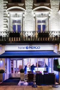 a hotel and indigo sign in front of a building at Hotel Indigo London Hyde Park Paddington, an IHG Hotel in London