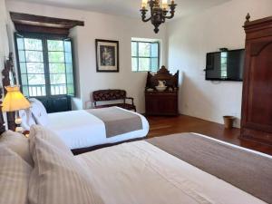 Katil atau katil-katil dalam bilik di Hacienda El Novillero