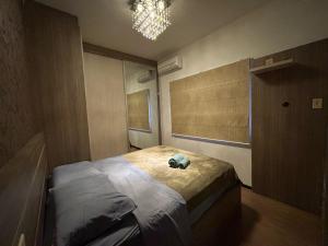 Ένα ή περισσότερα κρεβάτια σε δωμάτιο στο Apartamento inteiro muito aconchegante