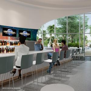 a group of people sitting at a bar at Universal's Stella Nova Resort in Orlando
