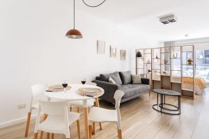 a living room with a couch and a table and chairs at Charming apart in Palermo in Buenos Aires