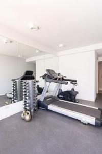a room with a gym with a treadmill and a mirror at Charming apart in Palermo in Buenos Aires