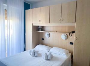 Postel nebo postele na pokoji v ubytování Hotel Hc Resort Lignano