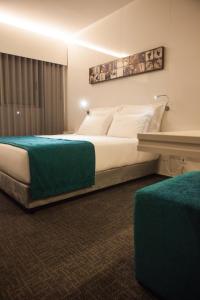 
Uma cama ou camas num quarto em Hotel Costa Verde
