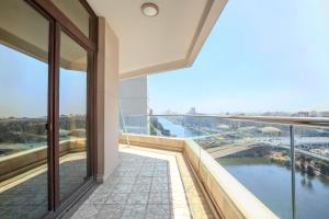 a balcony of a building with a view of a river at Om Kolthom Hotel in Cairo