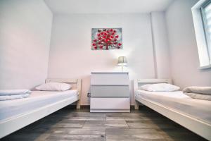 Posteľ alebo postele v izbe v ubytovaní Apartamenty Izabell by Housine