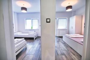 Posteľ alebo postele v izbe v ubytovaní Apartamenty Izabell by Housine