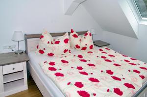 En eller flere senge i et værelse på Haus Auszeit