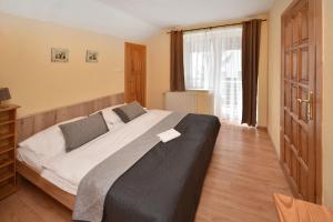 Posteľ alebo postele v izbe v ubytovaní Apartmany ZEA