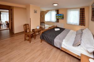 Posteľ alebo postele v izbe v ubytovaní Apartmany ZEA