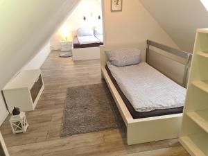 Ένα ή περισσότερα κρεβάτια σε δωμάτιο στο Apartmenthaus Çelik Bielefeld Süd Senne