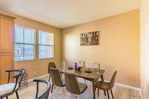 a dining room with a table and chairs at Entire Private 12-Guest 3-Bedroom Townhouse with Garage near San Diego Gaslamp in National City