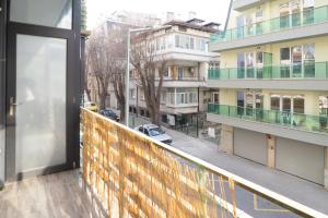 an apartment balcony with a view of a street at Seaside Estate - Cozy and Romantic - Parking Nearby in Varna City