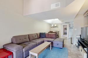 a living room with a couch and a table at Modern Scottsdale South in Scottsdale
