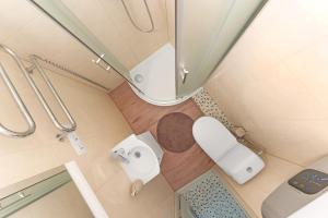 an overhead view of a bathroom with a toilet at Vilnius Old Town apartment in Vilnius +13 photos