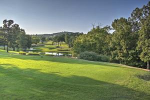 an overhead view of a golf course with a pond at 5 Mi to Strip! Pointe Royale Condo w/ Indoor Pool in Branson